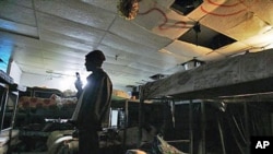 An African refugee surveys a vacant shelter, after an early morning police raid to deport illegal African immigrants, in Tel Aviv, Israel, February 2008. (file photo)