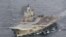 A photo taken from a Norwegian surveillance aircraft shows Russian aircraft carrier Admiral Kuznetsov in international waters off the coast of northern Norway, Oct. 17, 2016.