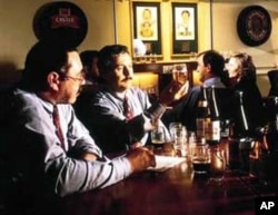 Beer tasters study some brew at South African Breweries Johannesburg headquarters