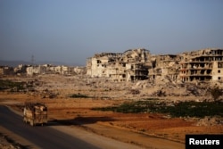 A general view of damaged buildings in Ein Terma, a district of eastern Ghouta, Syria, Feb. 26, 2019.
