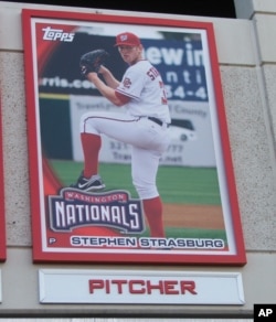 Stephen Strasburg's giant baseball card greets fans entering National Park in Washington