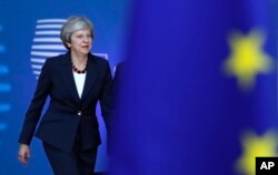 British Prime Minister Theresa May arrives for an EU summit in Brussels, Oct. 17, 2018.