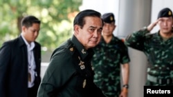 FILE - Thai Army chief General Prayuth Chan-Ocha arrives before a meeting to discuss the 2015 national budget at the Army Club in Bangkok, June 13, 2014. 