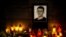 Candles and an image of investigative journalist Jan Kuciak are left outside Aktuality, the Slovakian news outlet where he worked. (Vladimir Simicek | AFP)