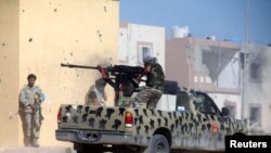 Des membres des forces gouvernementales libyennes reconnues par la communauté internationale.