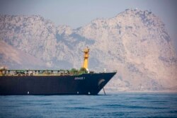 A view of the Grace 1 supertanker is seen backdropped by Gibraltar's Rock, as it stands at anchor in the British territory of Gibraltar, Aug. 15, 2019.