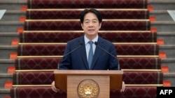 ภาพจากทำเนียบประธานาธิบดีไต้หวัน เมื่อ 13 มี.ค. แสดงให้เห็นปธน.ไล่ ชิง-เต๋อ ขณะกำลังขึ้นกล่าวเกี่ยวกับประเด็นการแทรกซึมจากจีน