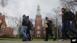 FILE - Brooklyn College students walk between classes on campus in Brooklyn, New York.