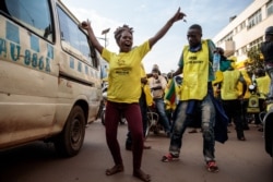Supporters of the National Resistance Movement (NRM) celebrate the victory of President Yoweri Museveni after the results of the presidential election in Kampala, Jan. 16, 2021.