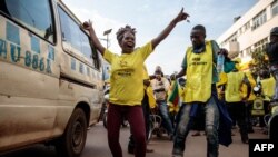 Supporters of the National Resistance Movement (NRM) celebrate the victory of President Yoweri Museveni after the results of the presidential election in Kampala, Uganda, on Jan. 16, 2021.