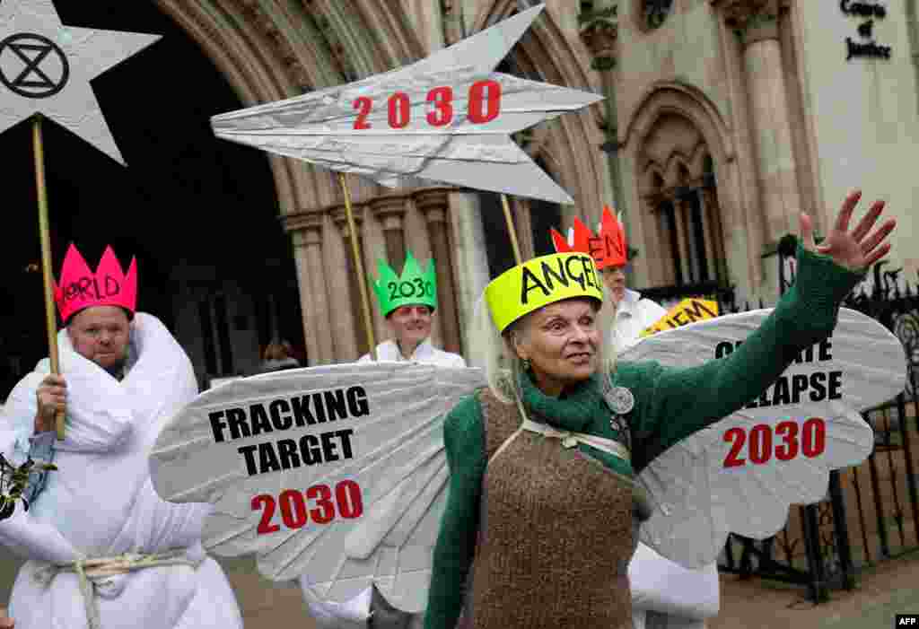 British fashion designer Vivienne Westwood, dressed as an angel, poses with other anti-fracking activists, dressed as Joseph, and the three wise men, as they demonstrate outside the Royal Courts of Justice, Britain&#39;s High Court, in central London.