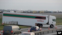 Some 150 trucks leave Manston Airfield during a 'no-deal' Brexit test for where 6,000 trucks could be parked at the airfield near Ramsgate in south east England, Jan. 7, 2019. 