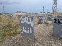 In an area of a graveyard set aside for the bodies of refugees found dead as they attempt to find safety, this grave says simply: "Afghan" on April 12, 2021 in Van, Turkey. (Heather Murdock/VOA)