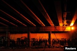 Migrants from Central America wait in a line for food inside an enclosure, where they are being held by U.S. Customs and Border Protection, after crossing the U.S.-Mexico border illegally and turning themselves in to request asylum, in El Paso, Texas, March 30, 2019.