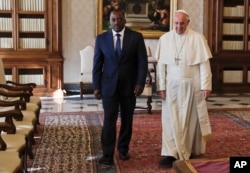 FILE - Pope Francis meets Congo President Joseph Kabila during a private audience in the pontiff's studio, at the Vatican, Sept. 26, 2016.