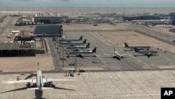 Qatari planes wait at Hamad International Airport (HIA) in Doha, Qatar. Qatar's foreign minister says Kuwait is trying to mediate a diplomatic crisis in which Arab countries have cut diplomatic ties.