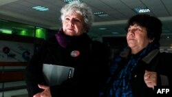Veronica de Negri (L), mother of photographer Rodrigo Rojas de Negri, killed during the Pinochet dictatorship and Alicia Lira, president of the Association of Relatives of Political Prisoners Executed leave a court in Santiago, Chile, July 24, 2015.
