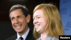 FILE - Abigail Fisher (R), a white suburban Houston student who asserted she was wrongly rejected by the University of Texas at Austin while minority students with similar grades and test scores were admitted thanks to the admissions policy, and Edward Bl
