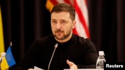 FILE - Ukraine's President Volodymyr Zelenskyy attends a press conference at the Ukraine Defense Contact Group meeting at Ramstein Air Base, Germany, Jan. 9, 2025. He called on allies on Sunday to honor all promises to supply Ukraine with weapons,