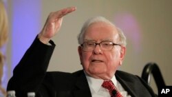FILE - Investor Warren Buffett talks with CNBC's Becky Quick at PurposeBuilt2017, a national conference sponsored by the Purpose Built Communities group that Buffett supports, in Omaha, Neb., Oct. 3, 2017. Buffett discussed what philanthropy can do to hel