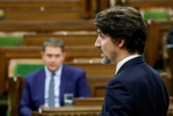 FILE - Canada's Prime Minister Justin Trudeau speaks in the House of Commons on Parliament Hill in Ottawa, Canada, April 20, 2020.