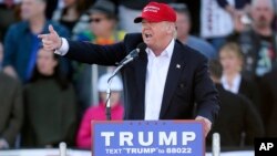FILE - Republican presidential candidate Donald Trump points as he speaks during a rally Feb. 28, 2016.
