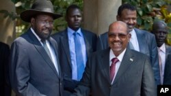 South Sudan's President Salva Kiir, left, meets with Sudan's President Omar al-Bashir, right, in the capital Juba, South Sudan, Jan. 6, 2014.