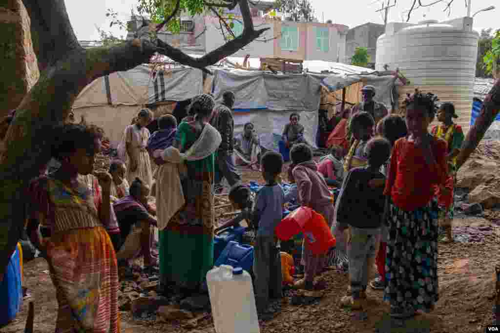 People collect drinking water in one of the many camps in Shire, June 11, 2021. (Yan Boechat/VOA) 