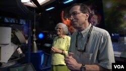 Sue Finley and colleague Steven Lichten both work for NASA's Deep Space Network, which provides communication with space probes. Licten says colleagues regard the six-decade NASA employee as a kind of "guru." (M. O'Sullivan/VOA)