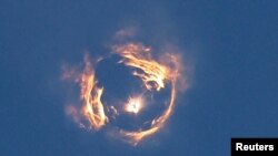 A formation is seen from SpaceX's next-generation Starship spacecraft's launch atop its Super Heavy booster on its eighth test at the company's Boca Chica launch pad in Brownsville, Texas, March 6, 2025. 