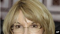 U.N. Under Secretary-General for Legal Affairs Patricia O'Brien smiles during a meeting with Cambodian Deputy Prime Minister Sok An in Phnom Penh, Cambodia, October 20, 2011.