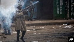 Riot police fire tear gas at protesters during clashes in the Kawangware area of Nairobi, Aug. 10, 2017.