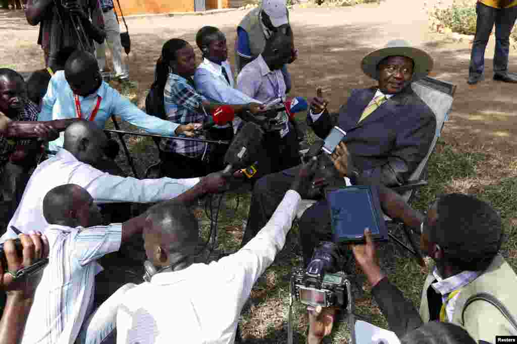 FILE - Uganda&#39;s incumbent President Yoweri Museveni speaks to the media soon after casting his vote at a polling station during the presidential elections in Kirihura, in western Uganda, Feb. 18, 2016.