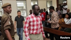 Tanzanian investigative journalist Erick Kabendera arrives at the Kisutu Residents Magistrate Court in Dar es Salaam, Tanzania, Aug. 19, 2019. 