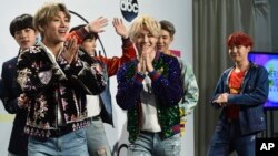 BTS poses in the press room at the American Music Awards at the Microsoft Theater, Nov. 19, 2017, in Los Angeles. 