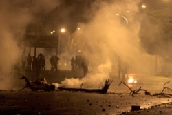 FILE - Demonstrators clash with security forces during a protest in the Tunisian city of Siliana, the capital of the governorate of the same name, about 130 kms southwest of Tunis, Jan. 16, 2021. (AFP photo/Feouzi Dridi)