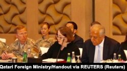 U.S., Taliban and Qatar officials during a meeting for peace talks. Doha, Qatar. (Reuters- Undated)