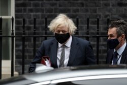 British Prime Minister Boris Johnson leaves 10 Downing Street to attend the weekly Prime Minister's Questions at the Houses of Parliament, in London, March 24, 2021.