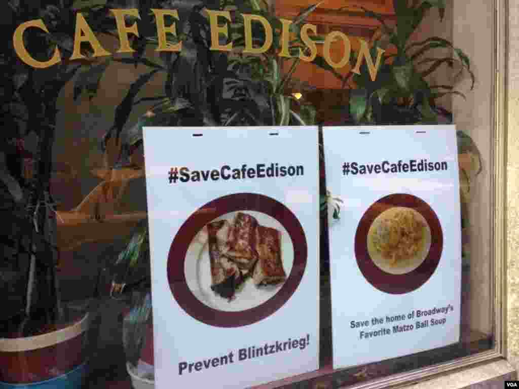Signs touting the Twitter campaign to save the café are posted in the diner’s front window, VOA / Jeff Lunden.