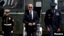 FILE - U.S. President Joe Biden walks from Marine One to board Air Force One as he departs on travel.