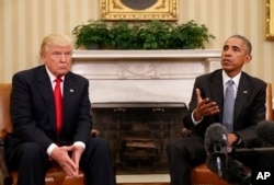 FILE- President Barack Obama meets with President-elect Donald Trump at the White House.