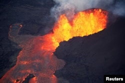 Lava erupts in Leilani Estates during ongoing eruptions of the Kilauea Volcano in Hawaii, June 5, 2018.