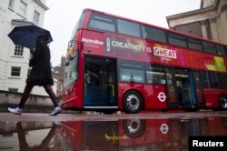 FILE -A BYD bus is displayed at a UK Trade and Investment event in London, Britain October 21, 2015. Chinese investment into low carbon London black cabs and a deal involving luxury sports carmaker Aston Martin are part of a series of business announcements during a state visit by China's president to London.