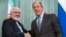 FILE - Iranian Foreign Minister Mohammad Javad Zarif (L) and Russian Foreign Minister Sergei Lavrov are seen shaking hands.
