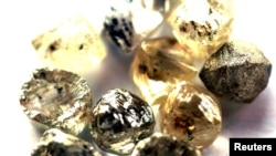 FILE - In this undated photo, rough diamonds are displayed at the Botswana Diamond Valuing Company in Gaborone.