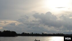 A fishing boat floats on the Mekong river at Sambor in Cambodia's Kratie Provice, a site chosen for a proposed 18-kilometer hydro-dam.
