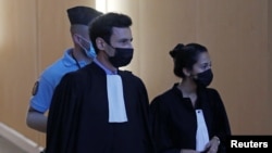 Olivia Ronen and Martin Vettes, lawyers of Salah Abdeslam, one of the accused, who is widely believed to be the only surviving member of the group suspected of carried out the attacks, arrive for the start of the trial of the Paris' November 2015 attacks 