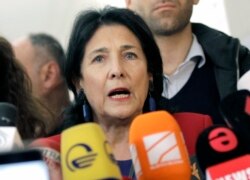 Georgian President Salome Zurabishvili, speaks to the media at a polling station during the presidential election at the polling station in Tbilisi, Georgia, Oct. 28, 2018.