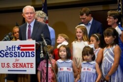 Former U.S. Attorney General Jeff Sessions, joined by family members, delivers his concession speech Tuesday, July 14, 2020, in Mobile, Ala.