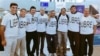 Former high school classmates pose at the international airport in Rosario, Argentina, Oct. 28. From left: Hernan Ferruchi, Alejandro Pagnucco, Ariel Erlij, Ivan Brajckovic, Juan Pablo Trevisan, Hernan Mendoza, Diego Angelini and Ariel Benvenuto.